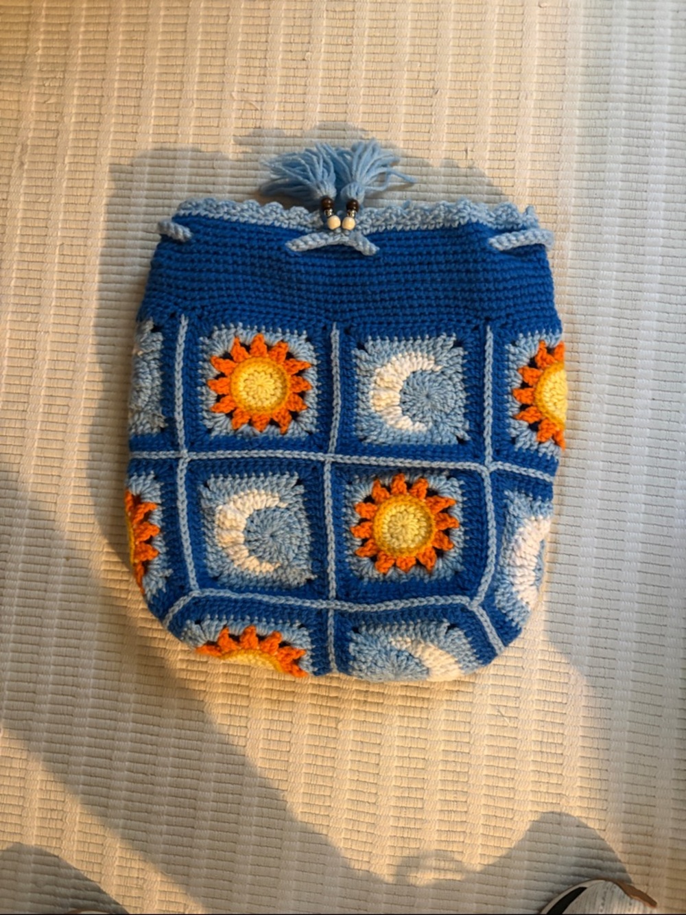 Handmade Blue Crochet Drawstring Bag with Sun & Moon Motifs